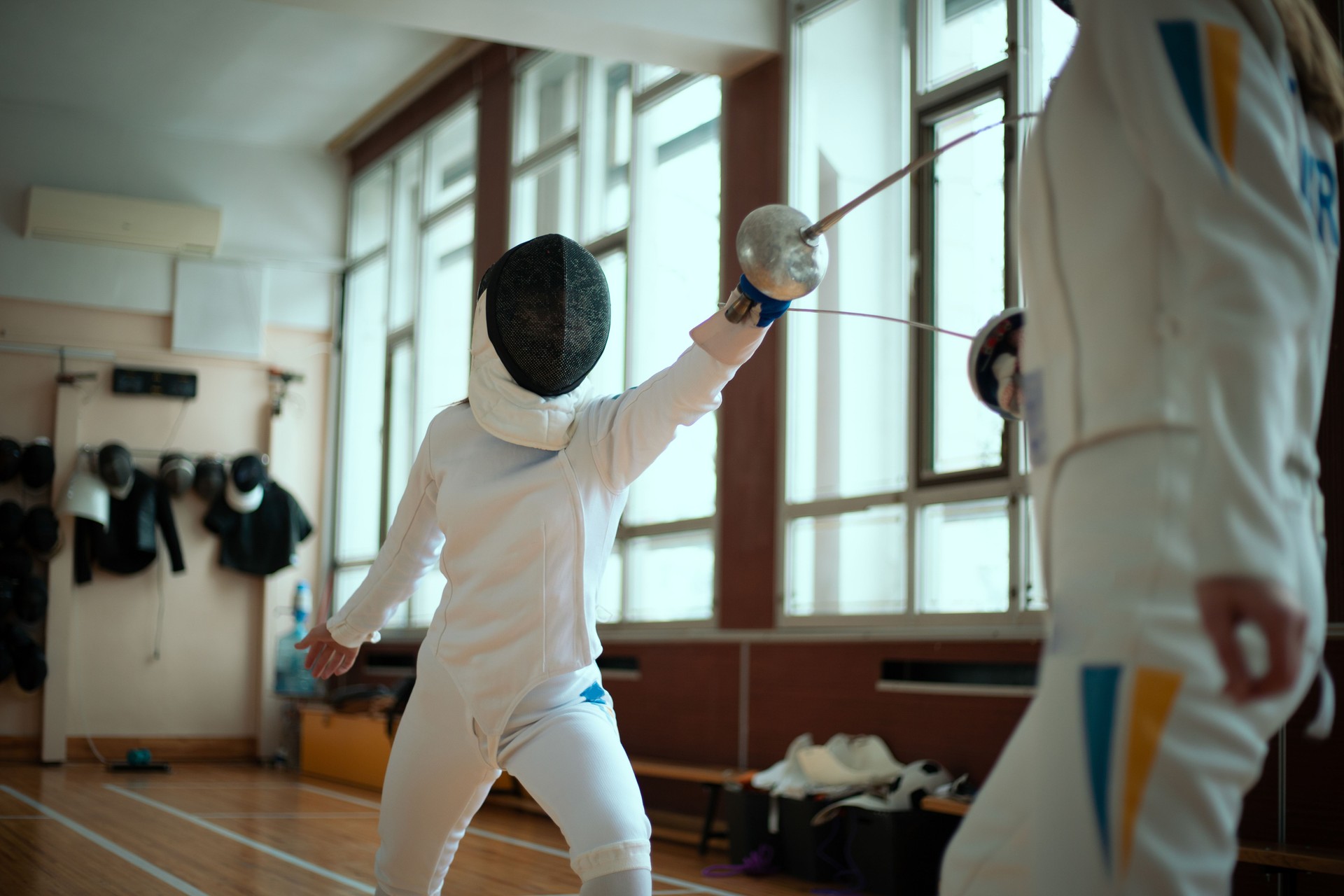 Girls fencers training in the fencing hall